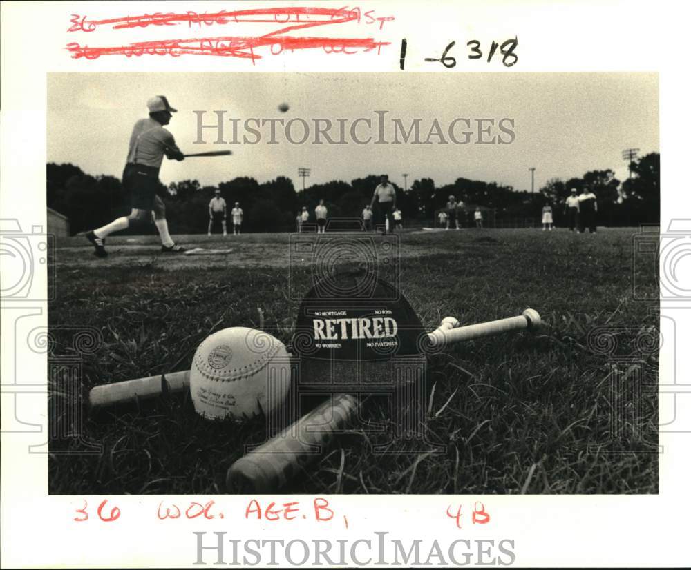 1985 Press Photo Clayton Falgout hits ball during warm up for softball game- Historic Images