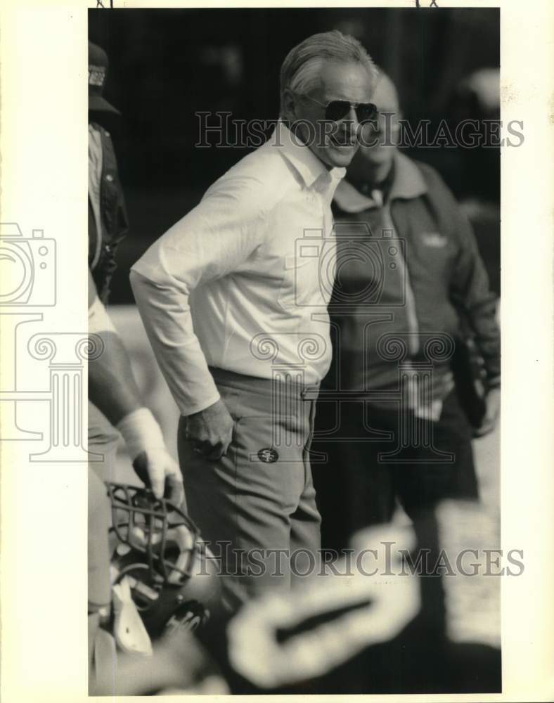 1990 Press Photo George Sieferth watches a football game - noc58010- Historic Images