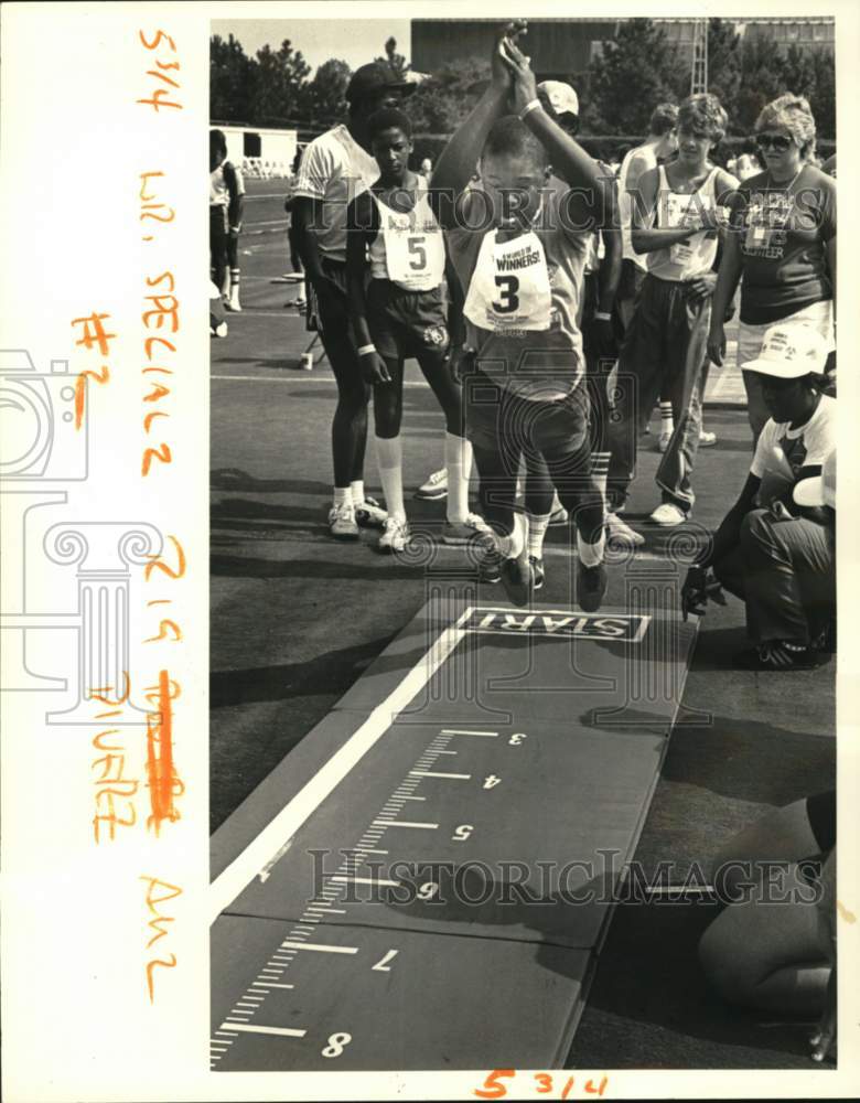 1983 Press Photo Baton Rouge-Savalle Lane in Special Olympics standing long jump- Historic Images