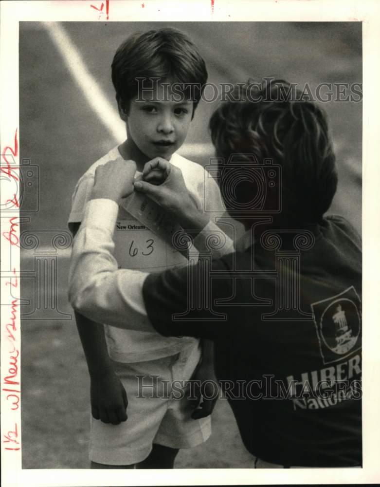 1985 Press Photo Michael Avenel gets a third-place ribbon at Special Olympics.- Historic Images