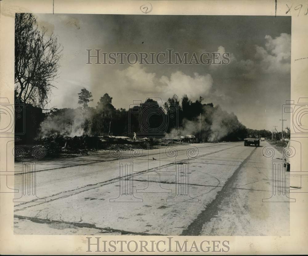 1951 Press Photo Smoke pours from burning trash covering Gentily Highway
