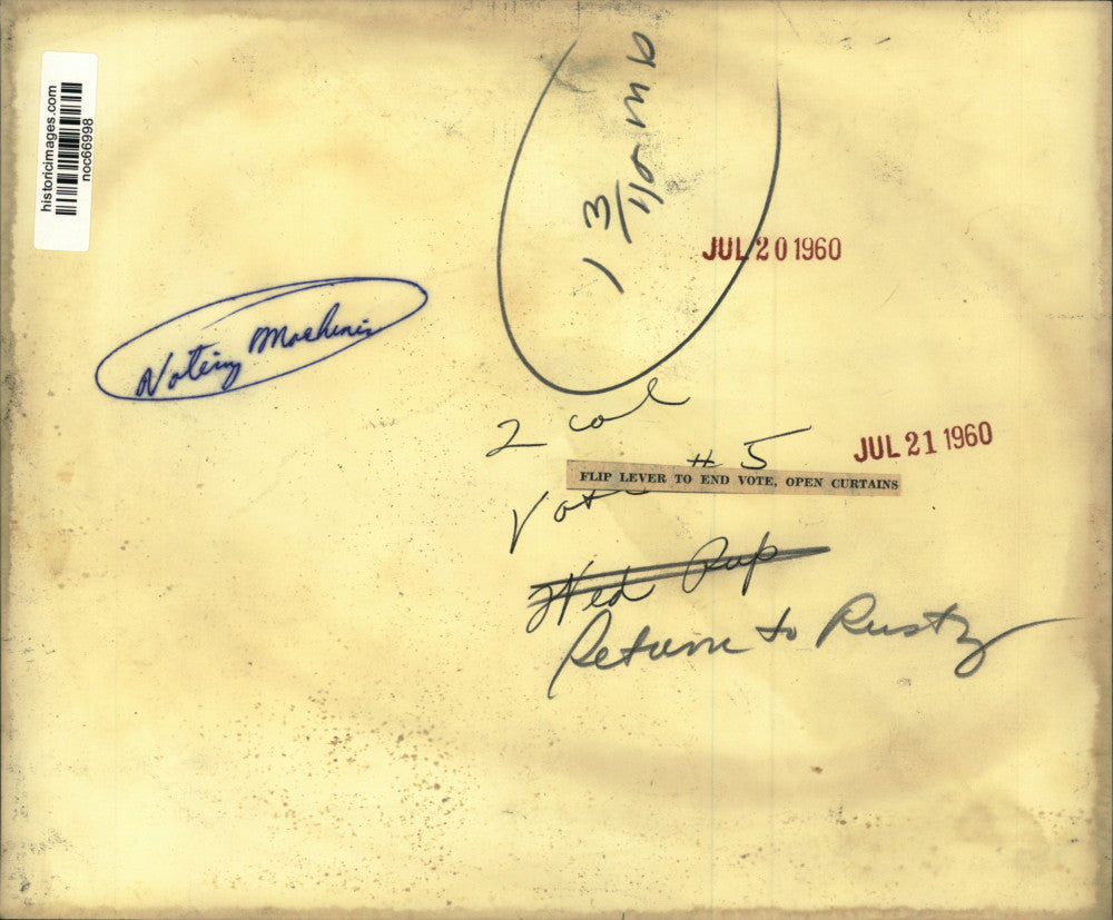 1960 Press Photo Flip lever to end vote, open curtains- Voting Machine