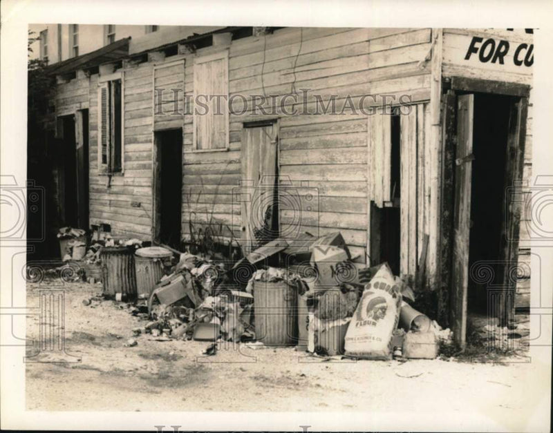 Load image into Gallery viewer, 1957 Press Photo Garbage in back of Butter Crisp Place on St. Charles Avenue
