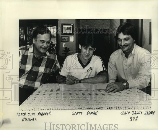 1985 Press Photo Scott Dimak signs coaches in Kenner, Louisiana - noc67990- Historic Images