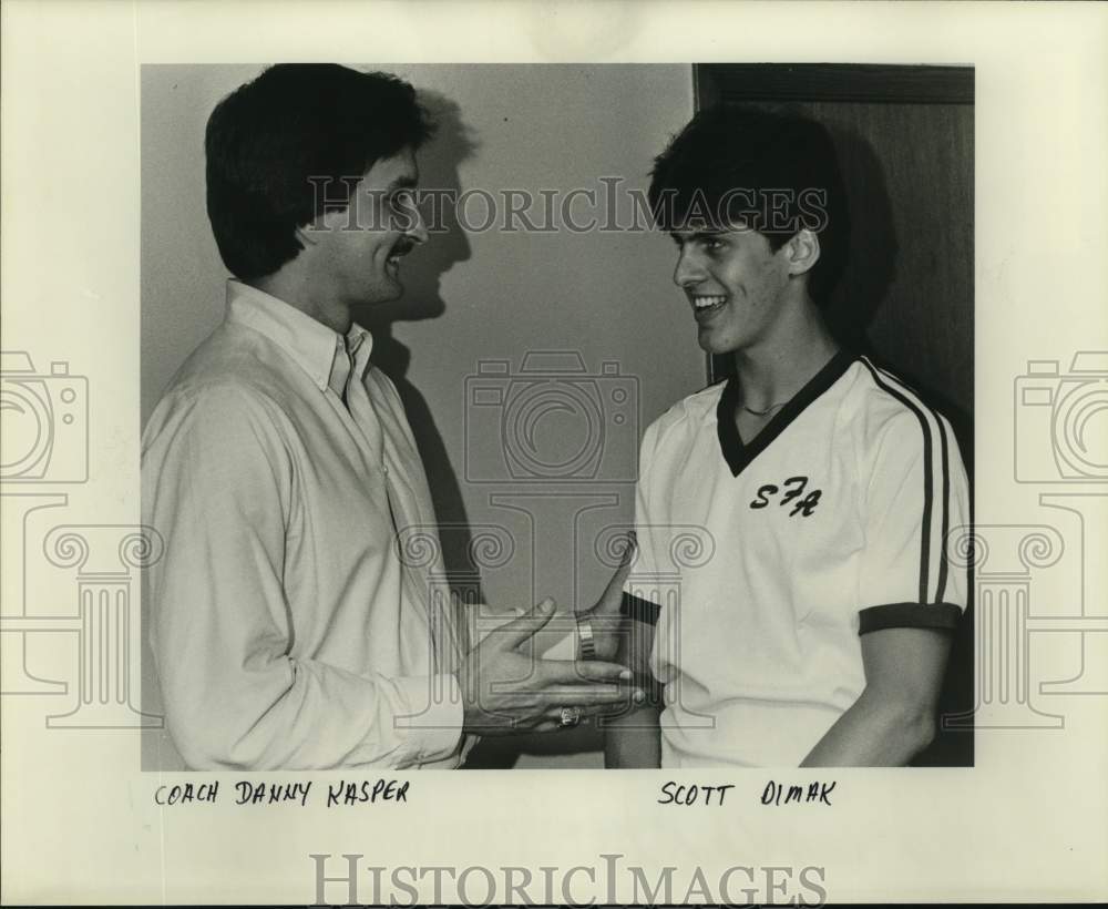 Press Photo Coach Danny Kaspar shakes Scott Dimak's hand - noc67992- Historic Images