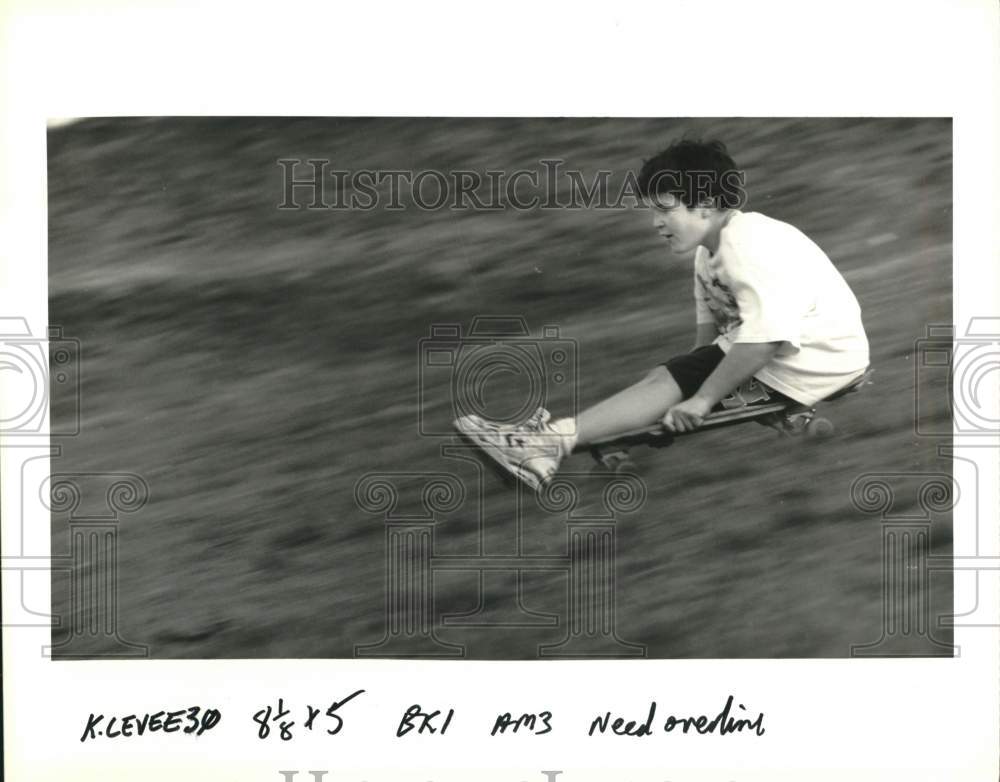 1992 Press Photo Brent Manint rides skateboard down Kenner levee. - noc69136- Historic Images