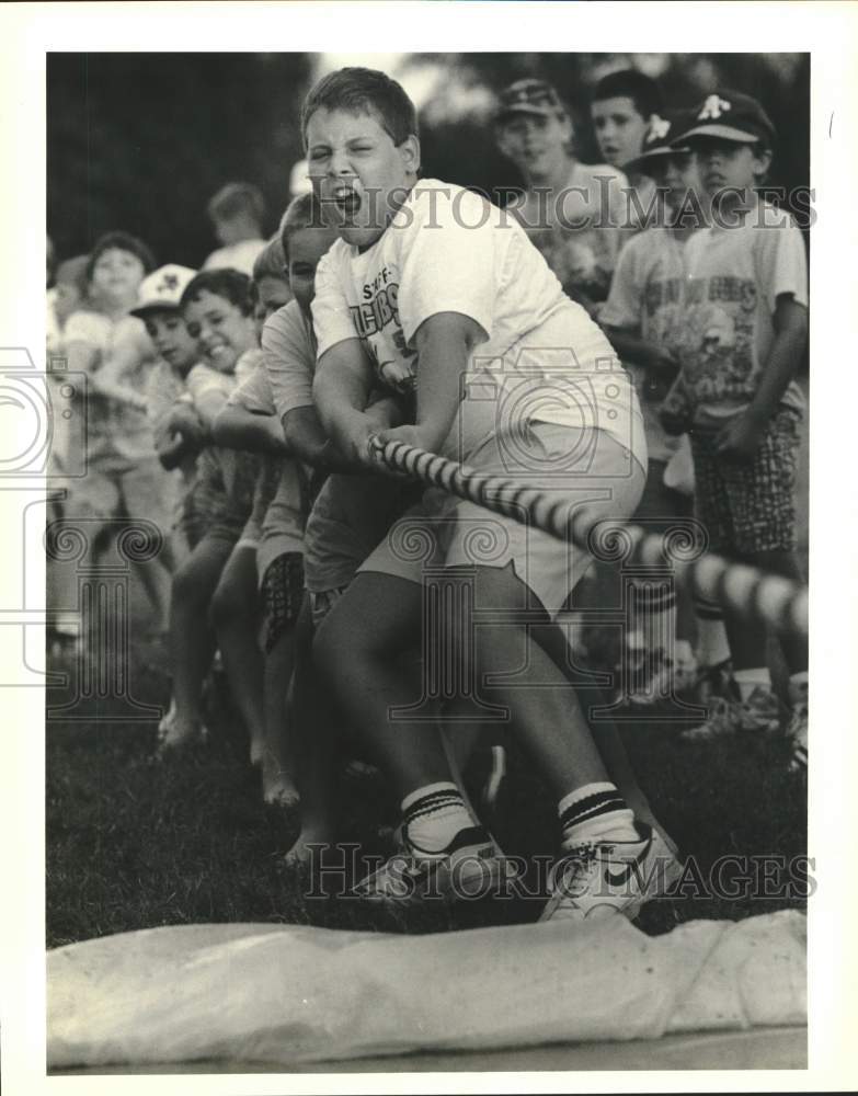 1990 Press Photo Ryan Fisher during a tug-of-war at Cajun Cubs Day Camp- Historic Images