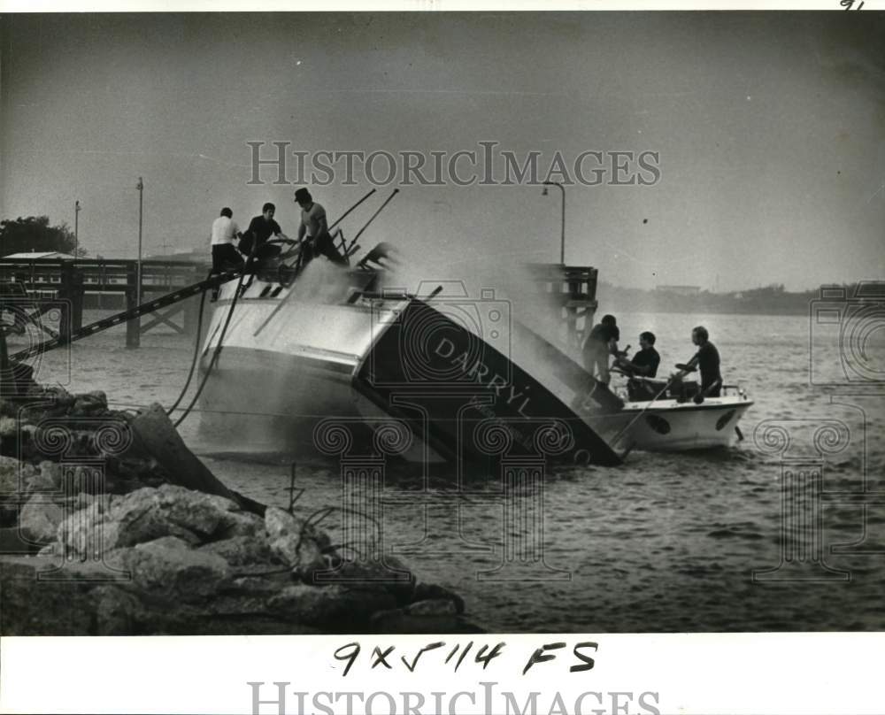 1978 Press Photo Firemen Clamber Aboard Burning Darryl Too at Breakwater Drive