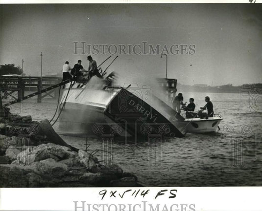 1978 Press Photo Firemen Clamber Aboard Burning Darryl Too at Breakwater Drive