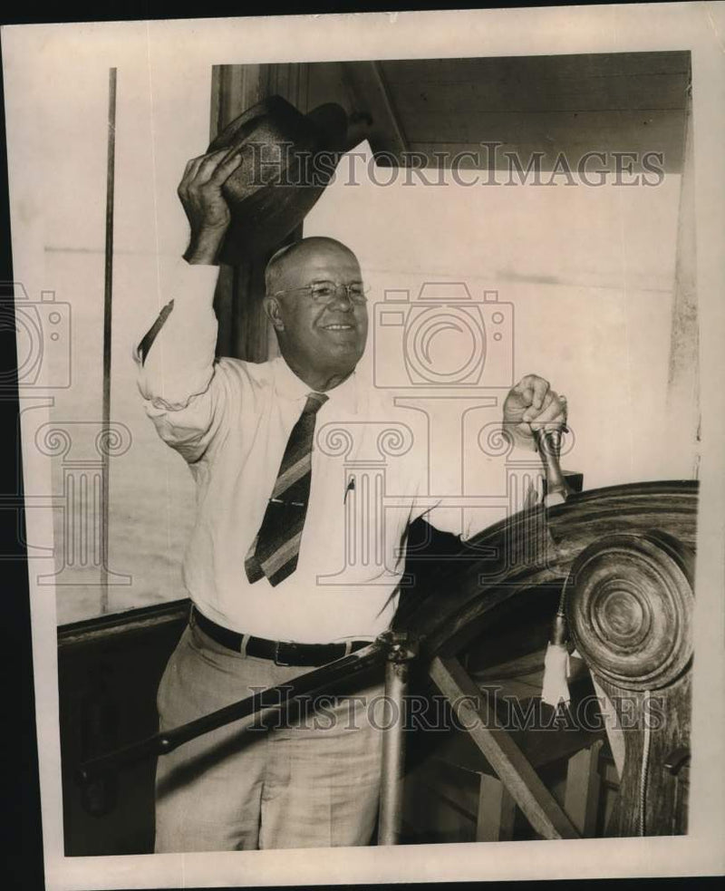Load image into Gallery viewer, 1958 Press Photo Captain Miguel Torres watches the surging river in New Orleans
