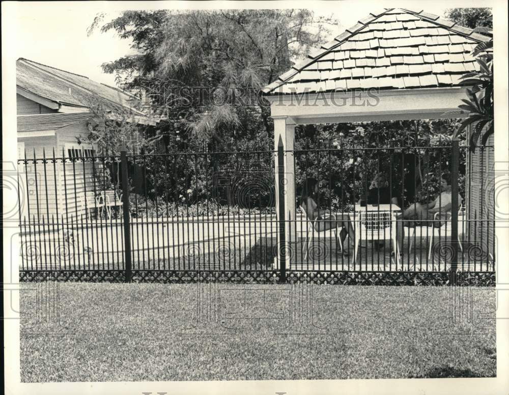 1973 Press Photo A family enjoying their backyard swimming pool - noc86035- Historic Images