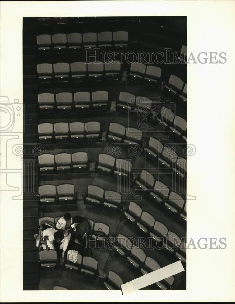 1984 Press Photo Three people have a section of seats during Hawks &amp; Bucks game- Historic Images