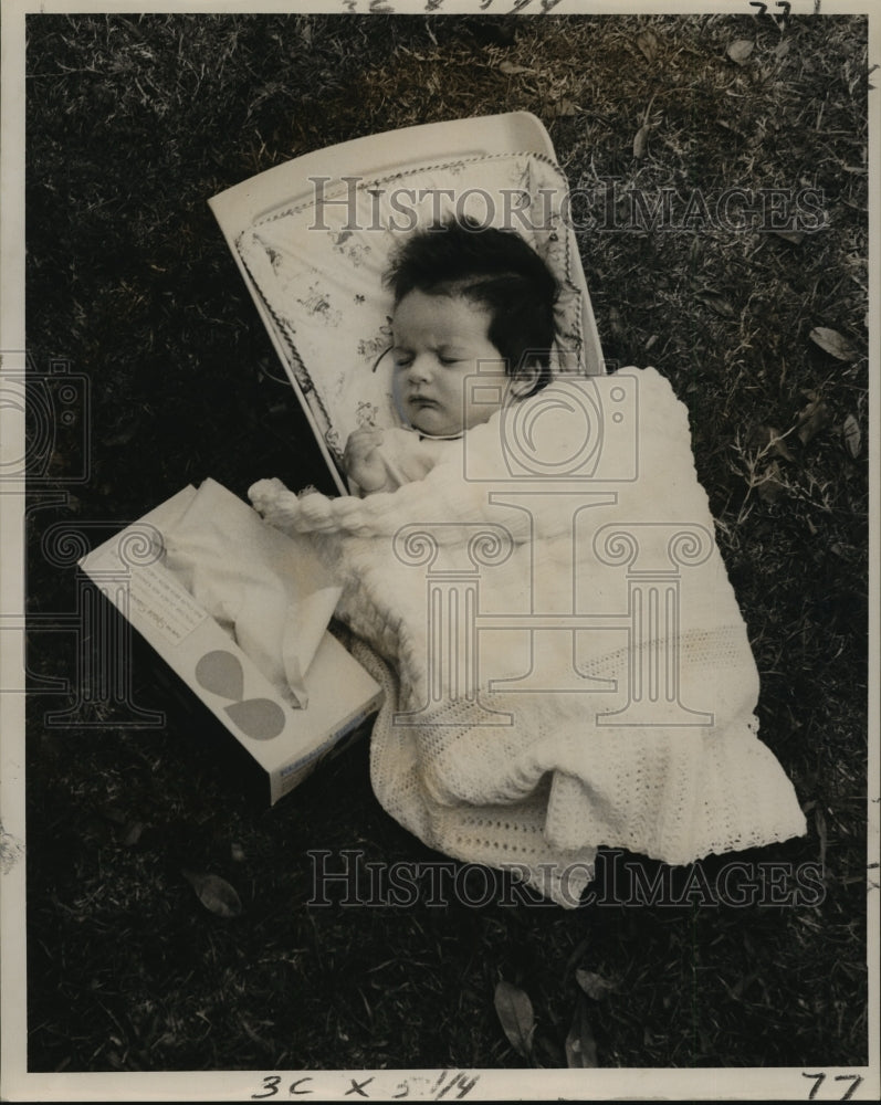 1962 Press Photo Carnival Parade- Weary Infant spectator gives up. - noca05203- Historic Images