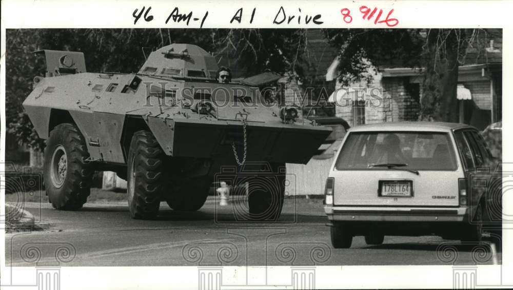 1985 Press Photo SWAT member takes NOPD armored personnel carrier out for spin