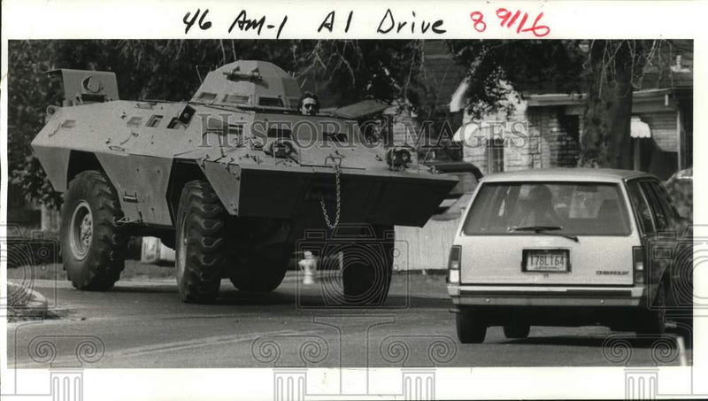 Load image into Gallery viewer, 1985 Press Photo SWAT member takes NOPD armored personnel carrier out for spin

