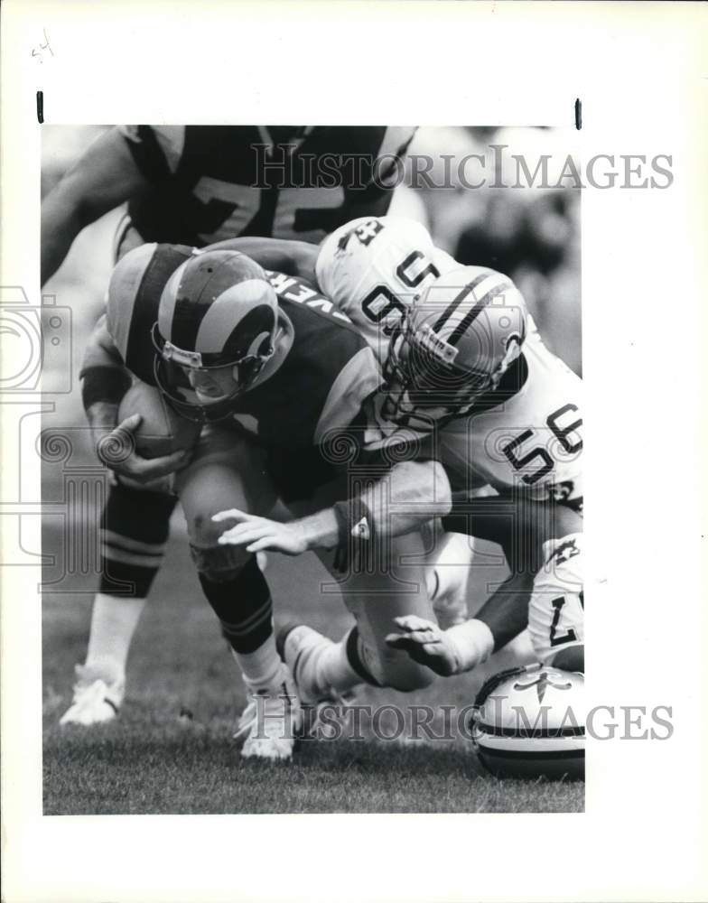 1989 Press Photo Saints linebacker Pat Swilling &amp; L.A.&#39;s Jim Everett in game- Historic Images