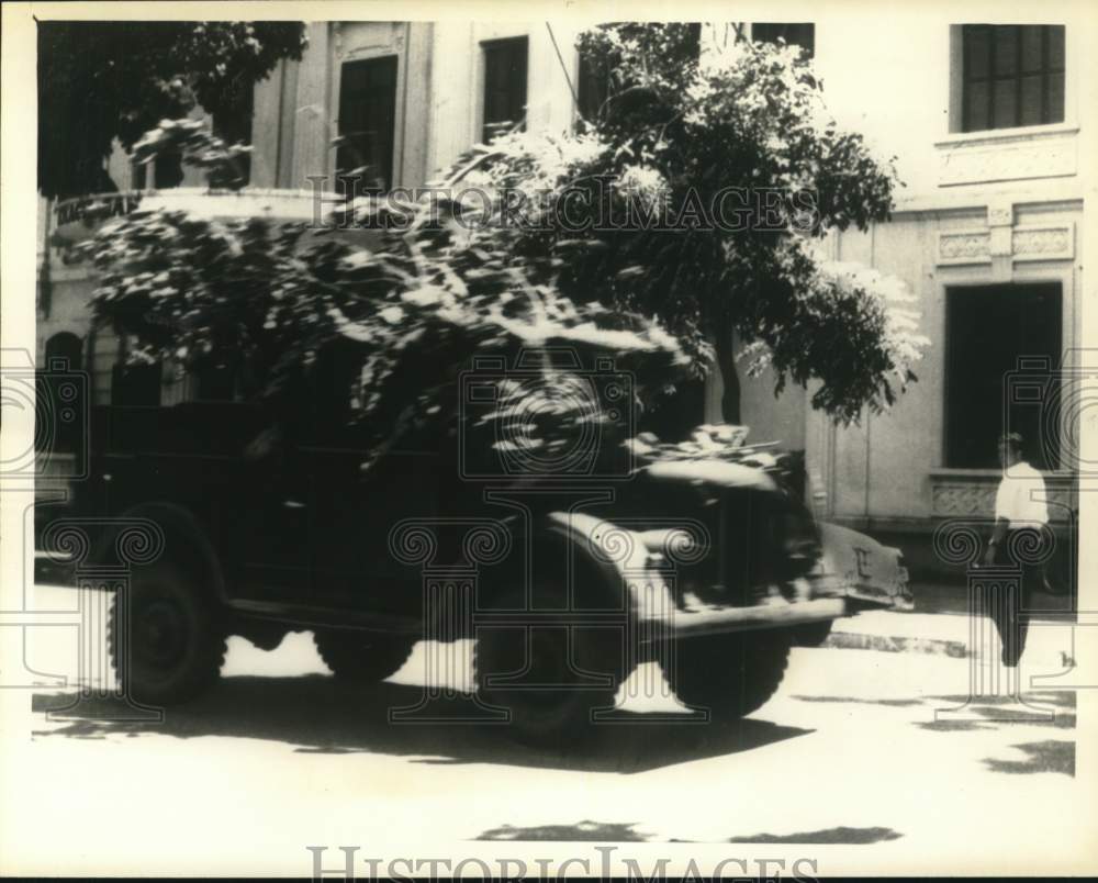 1965 Press Photo Camouflaged truck moves through main street of Hanoi