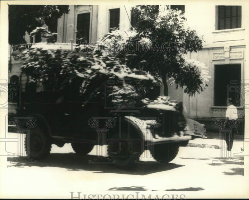 Load image into Gallery viewer, 1965 Press Photo Camouflaged truck moves through main street of Hanoi
