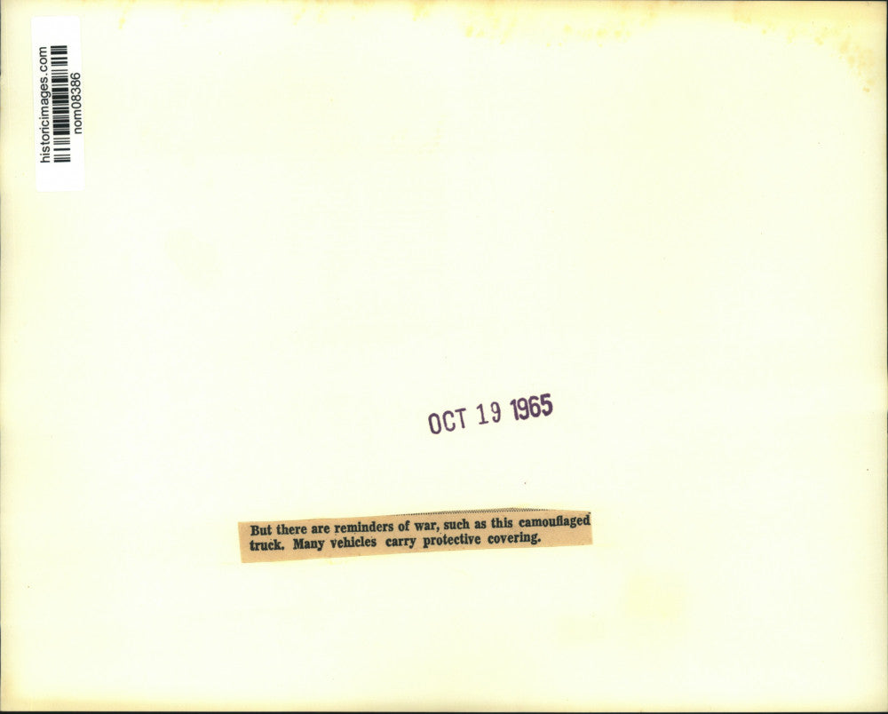 1965 Press Photo Camouflaged truck moves through main street of Hanoi