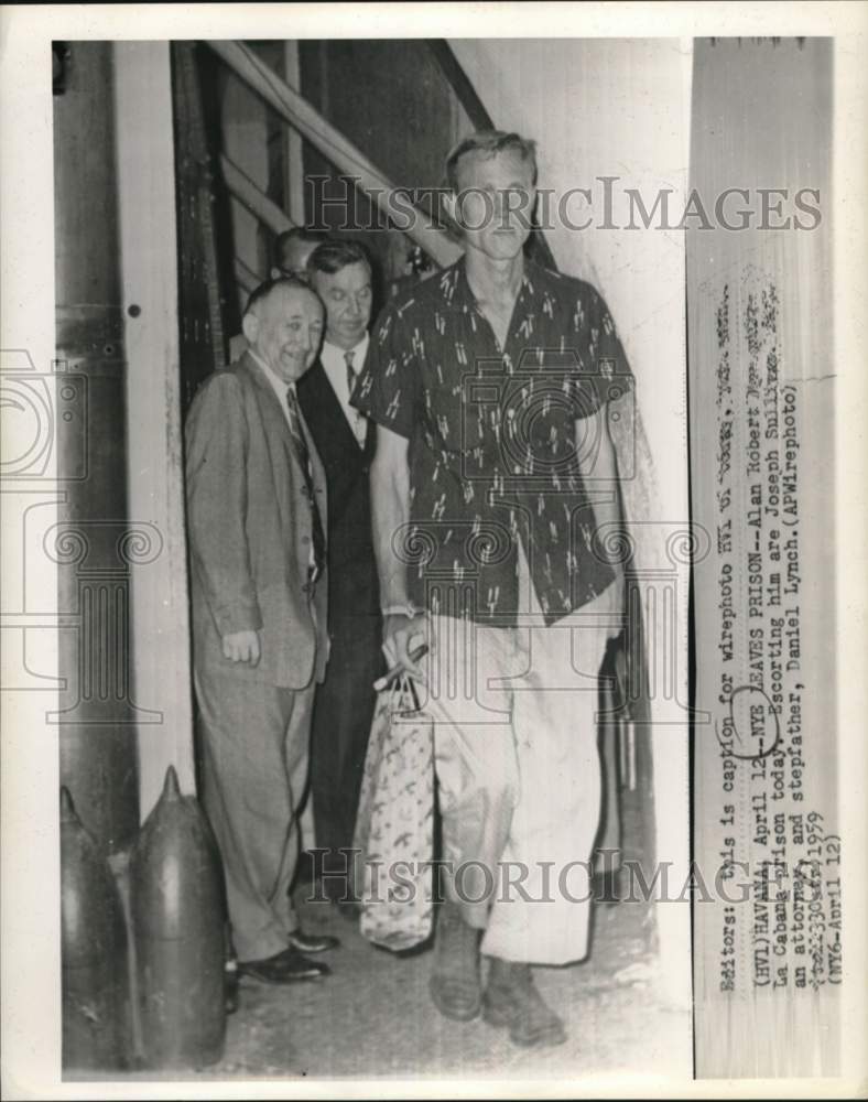Load image into Gallery viewer, 1959 Press Photo Alan Robert Nye leaves Cuba's La Cabana prison with attorney
