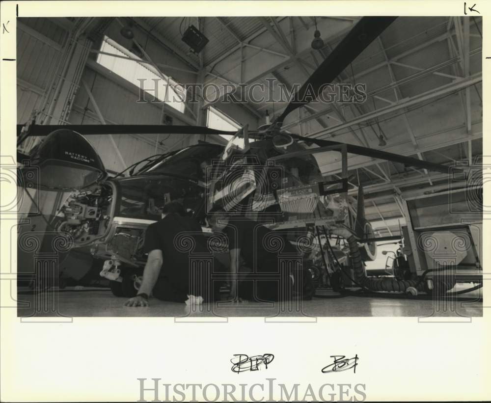 1989 Press Photo Coast Guard Maintenance Works on HH-65A Dolphin Helicopter- Historic Images