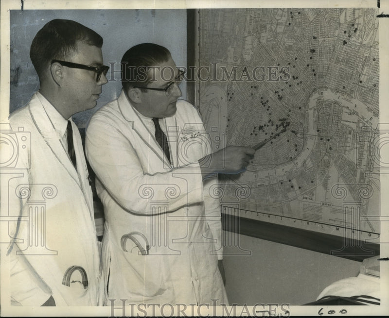 Load image into Gallery viewer, 1968 Press Photo Dr. John Bobear discusses tuberculosis with Dr. Albert Corne
