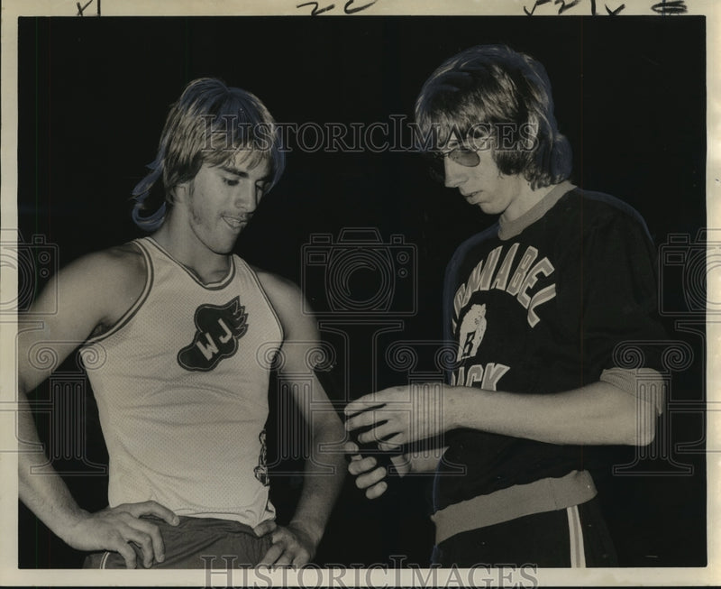 Load image into Gallery viewer, 1974 Press Photo Paul Brauninger, Dean Danos, track meet, look at damaged pole
