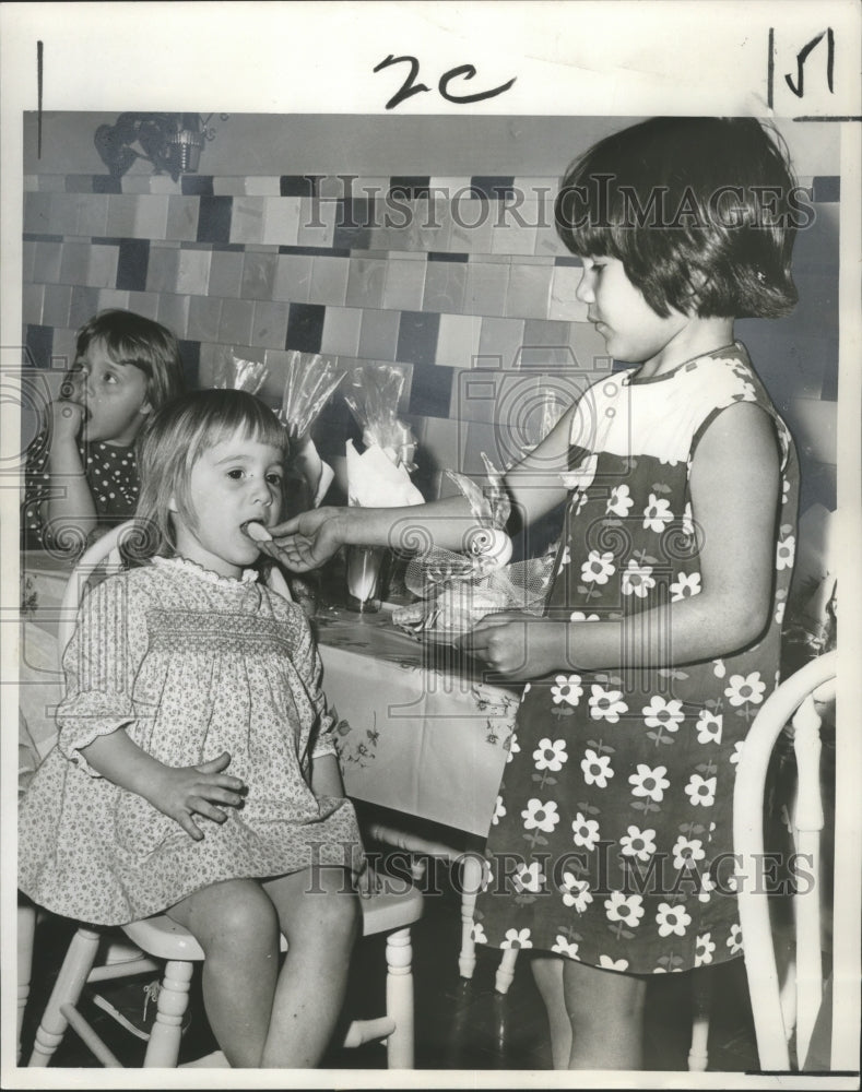 1966 Press Photo Children try eggs at the Easter Egg Hunt at Carbini Day Nursery