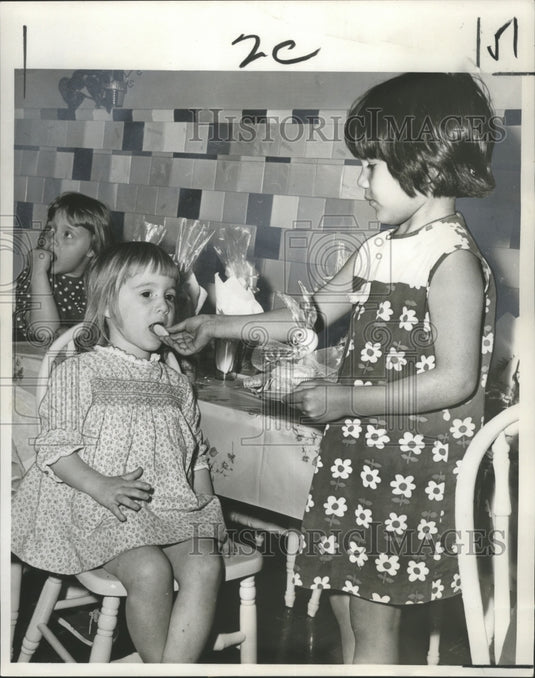 1966 Press Photo Children try eggs at the Easter Egg Hunt at Carbini Day Nursery