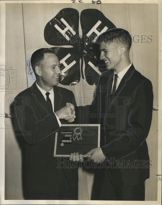 1963 Press Photo Edward Gassie gives Keric Buckner with commendation certificate