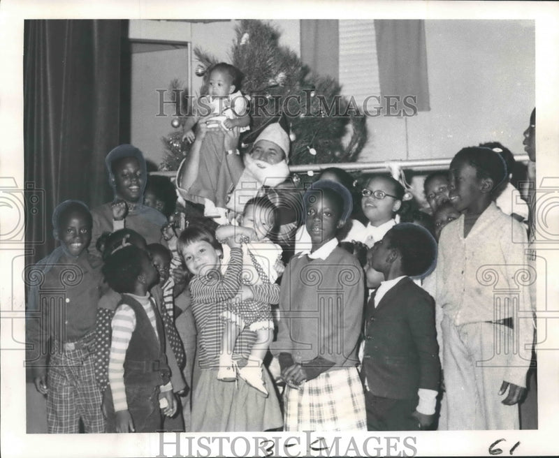 Load image into Gallery viewer, 1973 Press Photo Children of Lighthouse for the Blind workers meet Santa Claus
