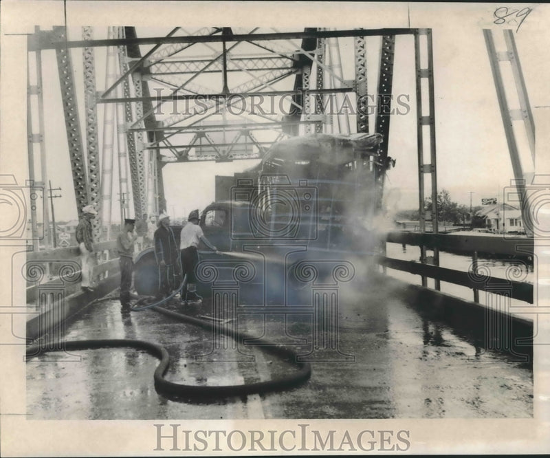 Load image into Gallery viewer, 1957 Press Photo Firemen put out a blaze after a truck crashed into Chef bridge
