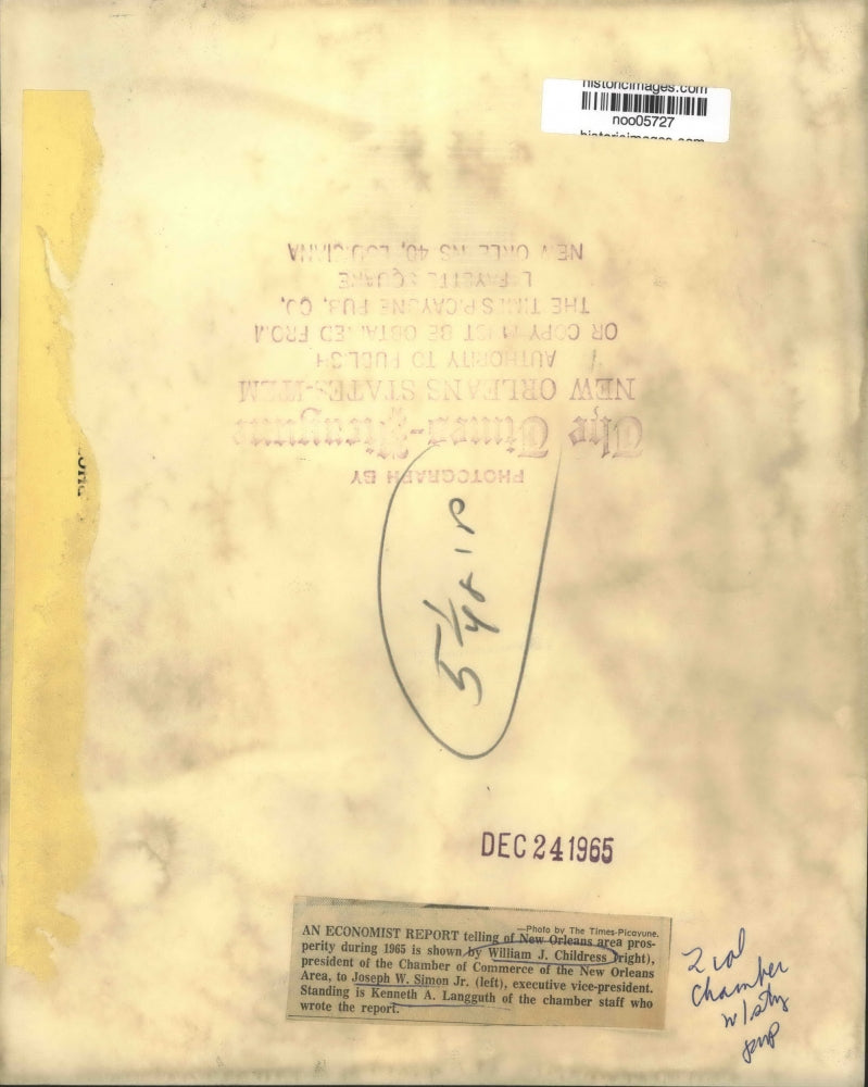 1965 Press Photo Chamber of Commerce of the New Orleans officers view report