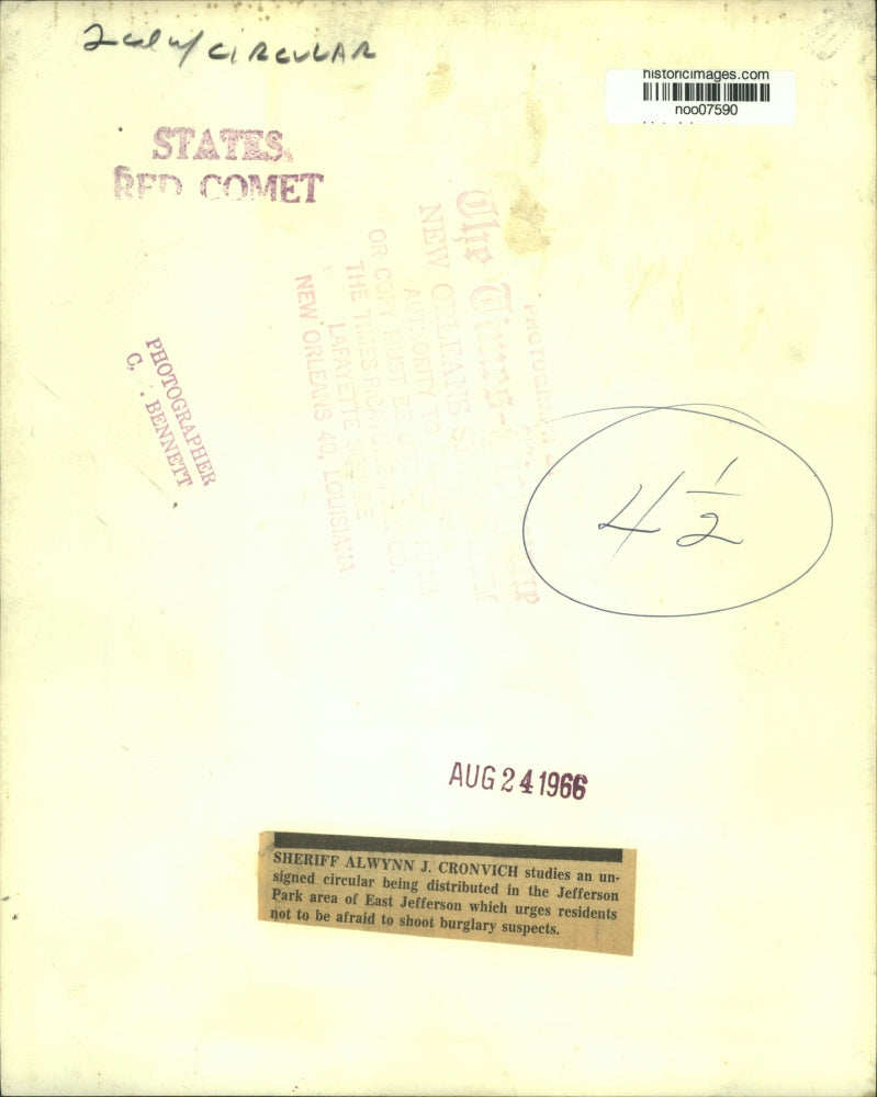 1966 Press Photo Sheriff Alwynn J. Cronvich Studies Circular About Shooting