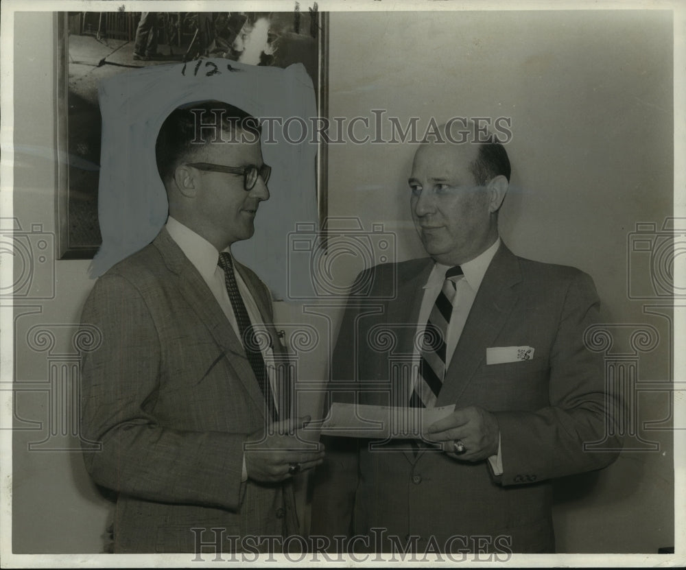 1958 Press Photo District sales manager E.J. Lacombe with Carl Couvillon