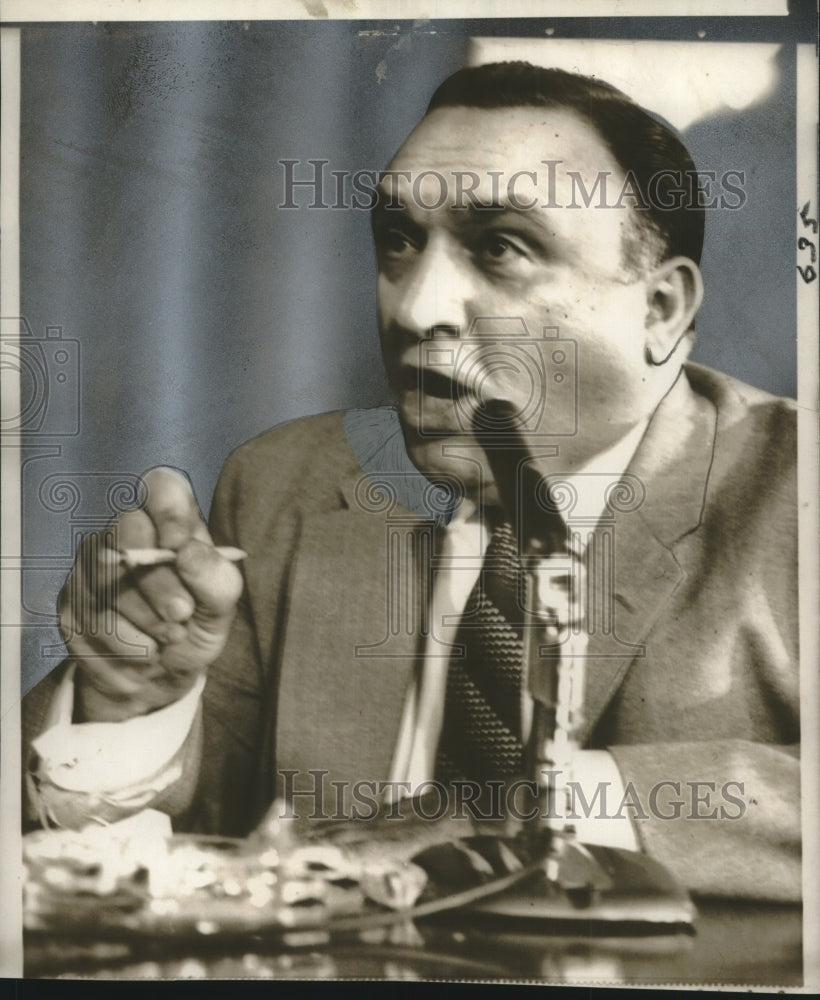 1957 Press Photo Anthony Doria answers financial operations questions
