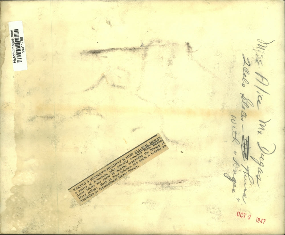 1947 Press Photo Miss Alice M.Dugas scans a book at International House library