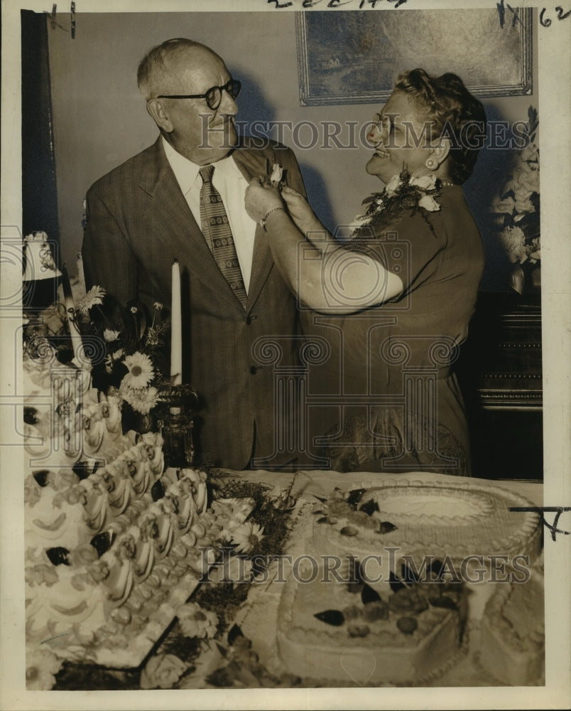 1955 Press Photo Mrs. Edward F. Duthu adjusting lapel rose of Mr. Duthu