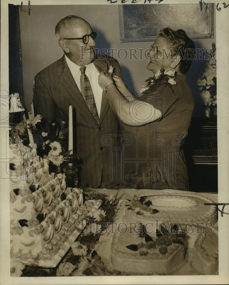 Load image into Gallery viewer, 1955 Press Photo Mrs. Edward F. Duthu adjusting lapel rose of Mr. Duthu
