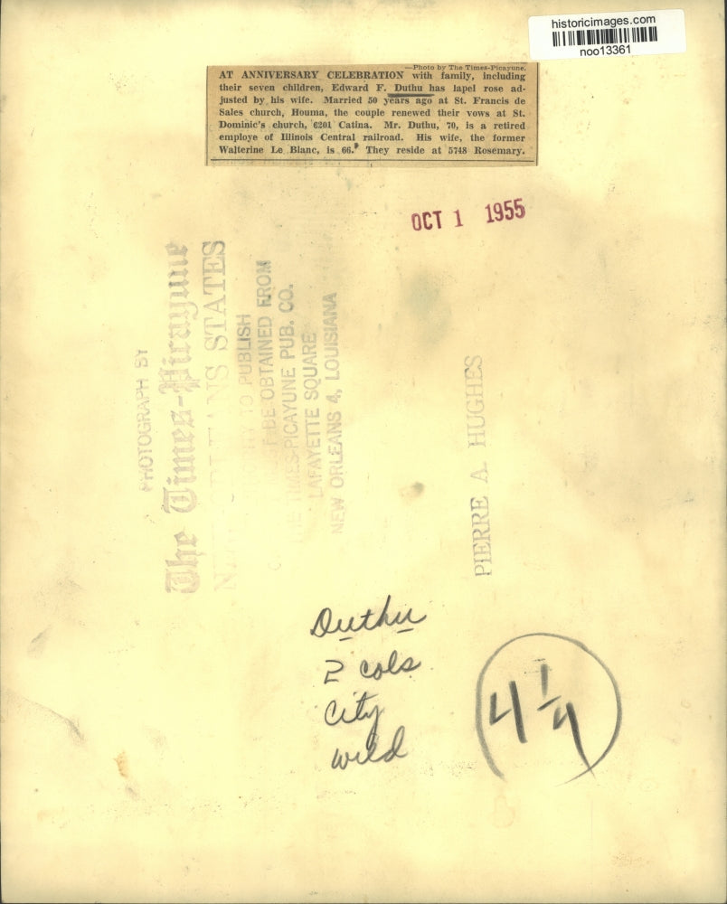 1955 Press Photo Mrs. Edward F. Duthu adjusting lapel rose of Mr. Duthu