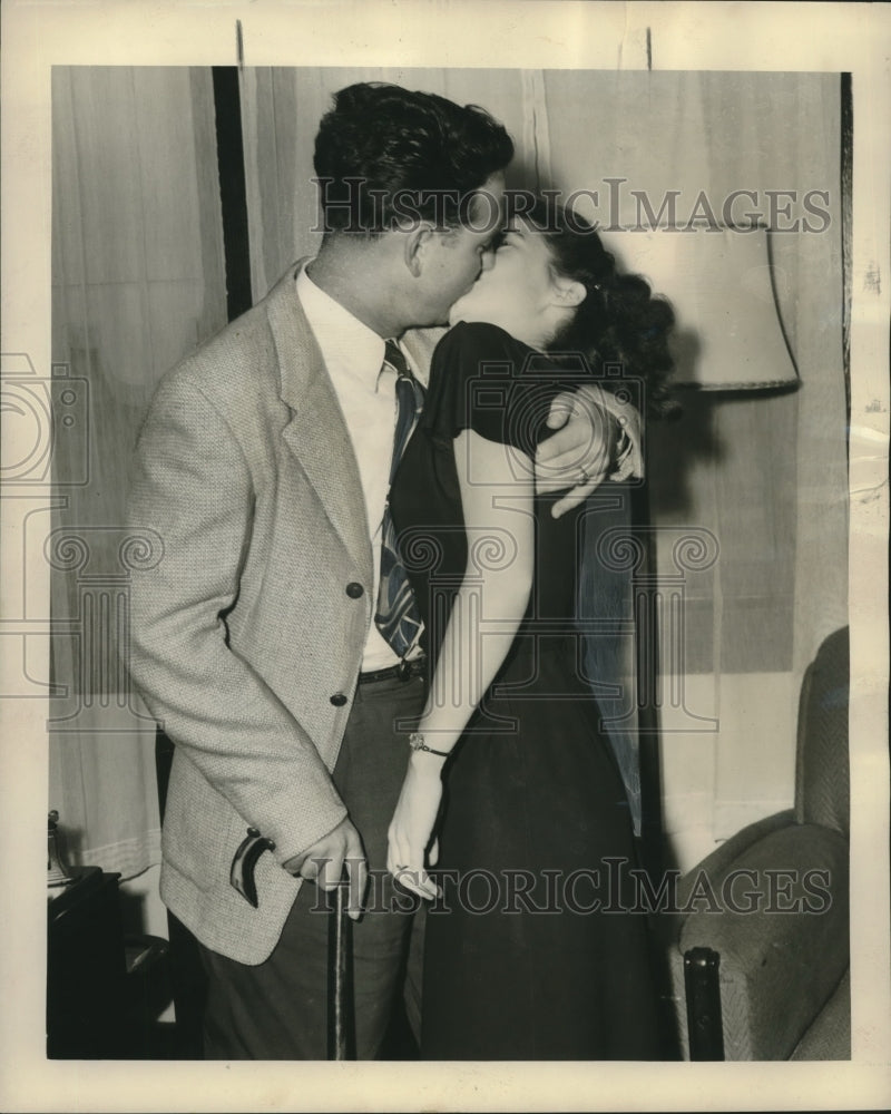 Load image into Gallery viewer, 1947 Press Photo Fiancees Edward Duplantier &amp; Elaine Smith Kiss - noo14546
