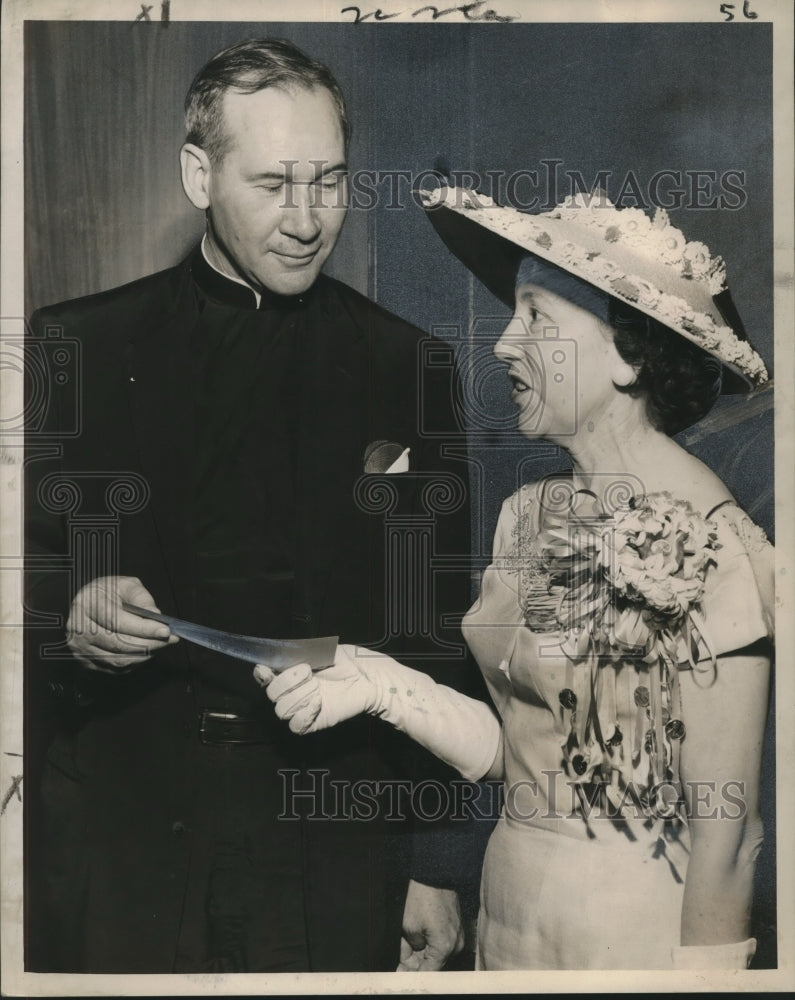 Load image into Gallery viewer, 1957 Press Photo Rev. W. Patrick Donnelly receives check from Mrs. J. Fred Deris
