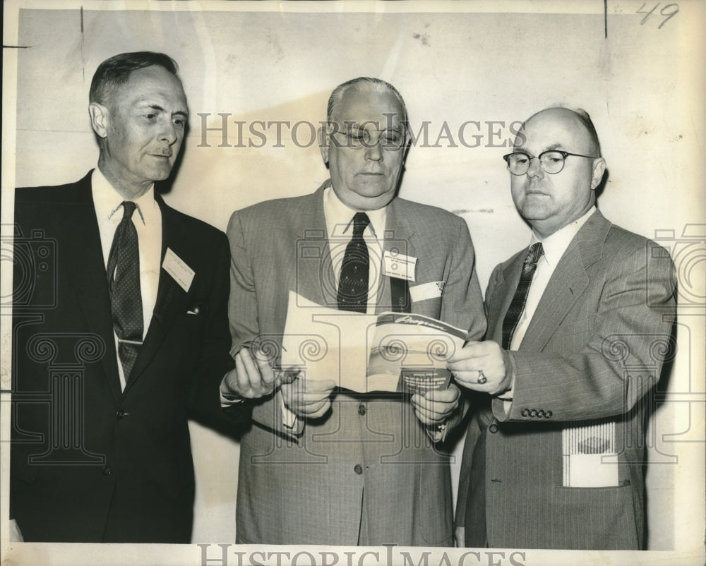 1957 Press Photo Dr. Marvin Fair &amp; others discuss foreign trade missions.- Historic Images