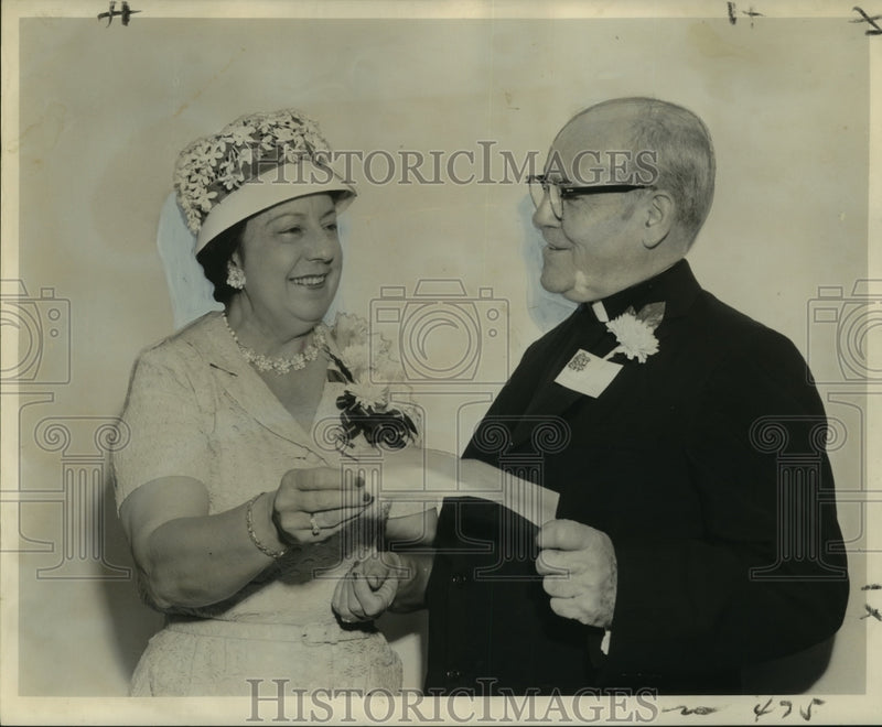 Load image into Gallery viewer, 1962 Press Photo Mrs. Albert Emke Presents Check to Reverend Andrew Smith, S.J.
