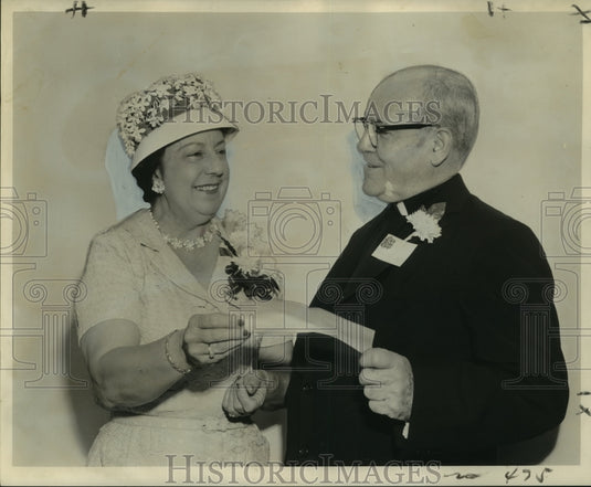 1962 Press Photo Mrs. Albert Emke Presents Check to Reverend Andrew Smith, S.J.