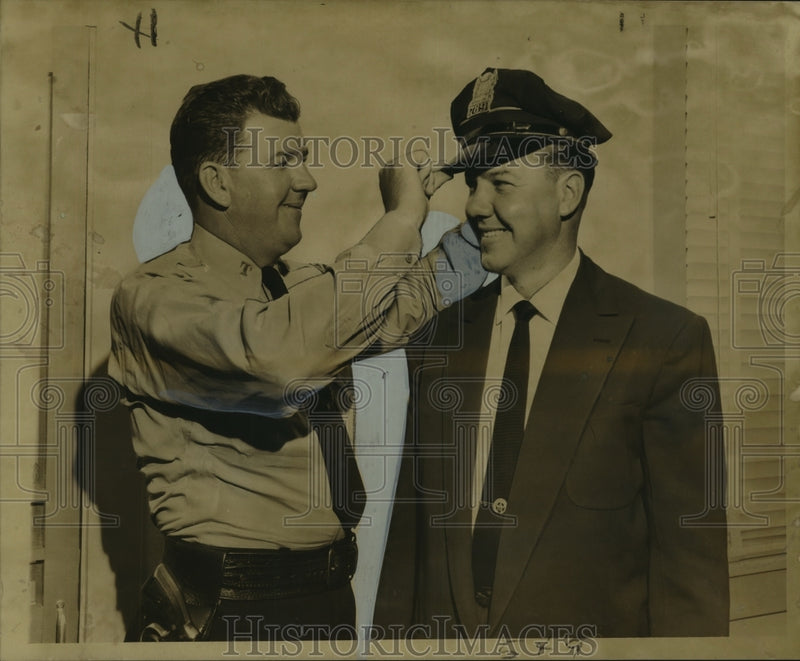Load image into Gallery viewer, 1956 Press Photo Patrolman Barklay Emmons Puts Hat On His Brother, Charles
