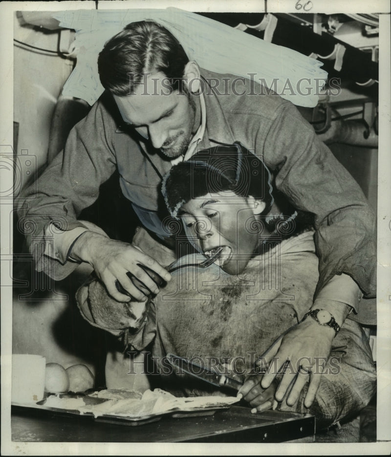 Load image into Gallery viewer, 1952 Press Photo U. S. Coast Guard entertaining Eskimo people on icebreaker
