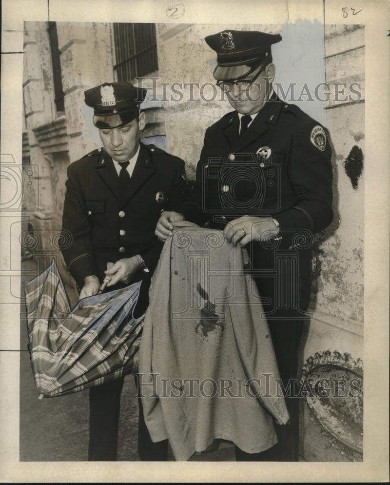 Load image into Gallery viewer, 1957 Press Photo Policemen hold items used in Ariel Frank's robbery - noo17431
