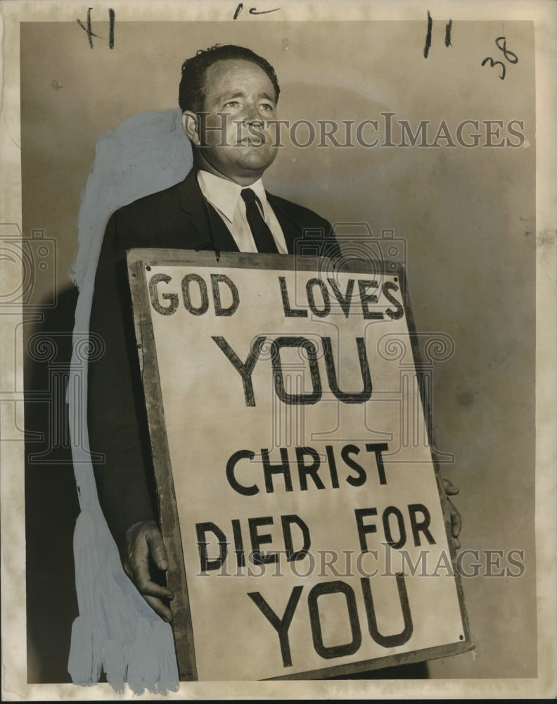 Load image into Gallery viewer, 1958 Press Photo Reverend Samuel Fife holding a sandwich board "God Loves You"
