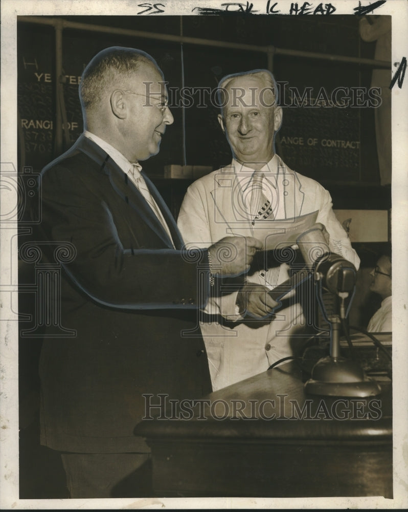 Load image into Gallery viewer, 1955 Press Photo New Orleans Cotton Exchange Doorman Receives Check - noo20223
